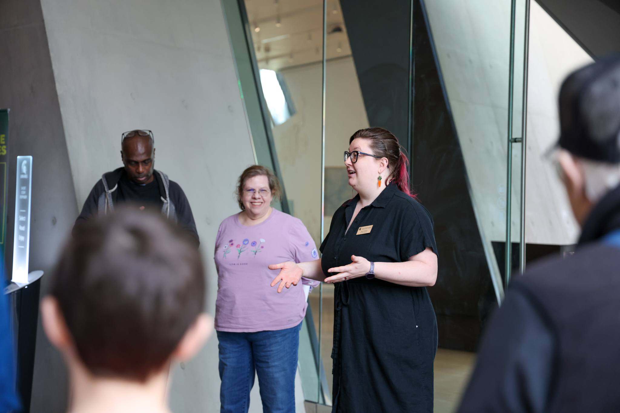 woman giving a tour inside a museum