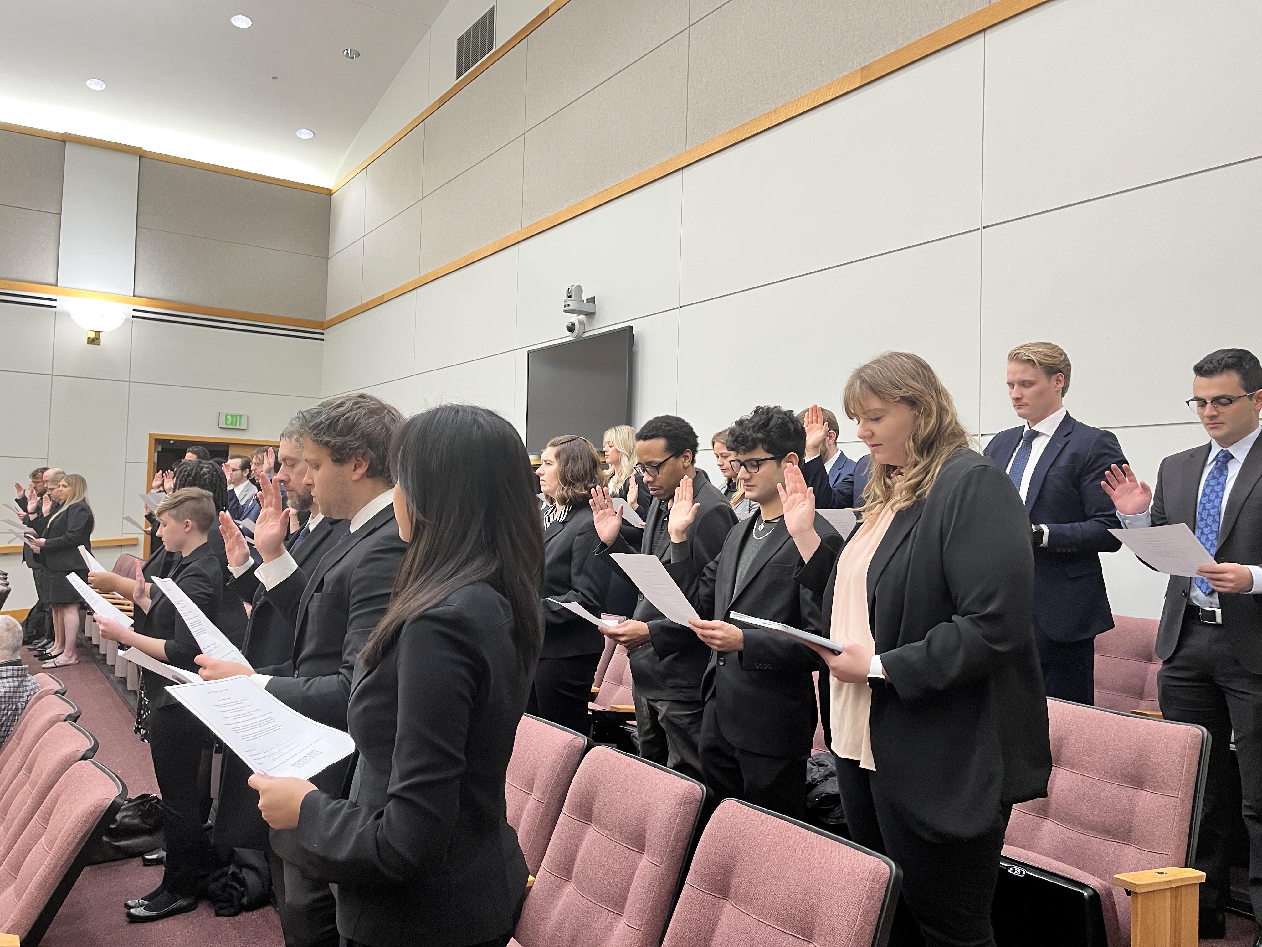 Clinic students take the student practice oath in a courtroom