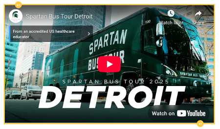 A video thumbnail showing a bus painted with MSU branding, with a red YouTube play icon superimposed on the image. The thumbnail is outlined in yellow with icons at the top and bottom to add space above or below, respectively.