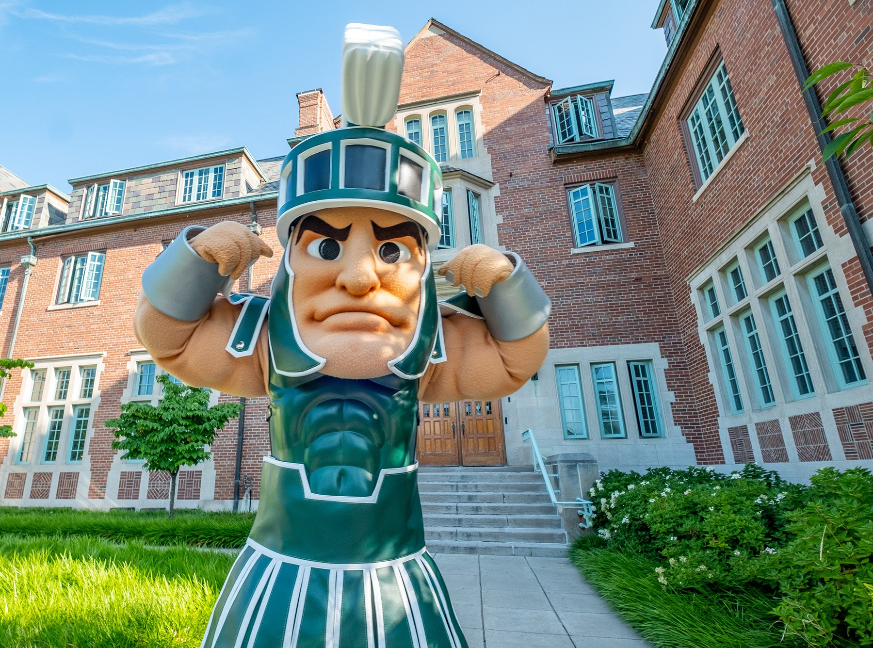 sparty mascot flexing muscles
