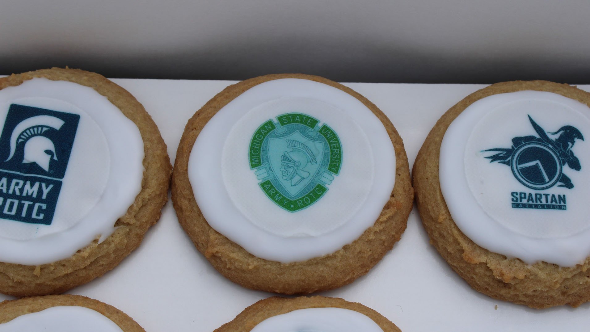 cookies from MSU Bakers with logos for the Army ROTC and Spartan Battalion in the frosting