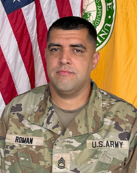 Portrait of Alfonso Roman in Army fatigues.