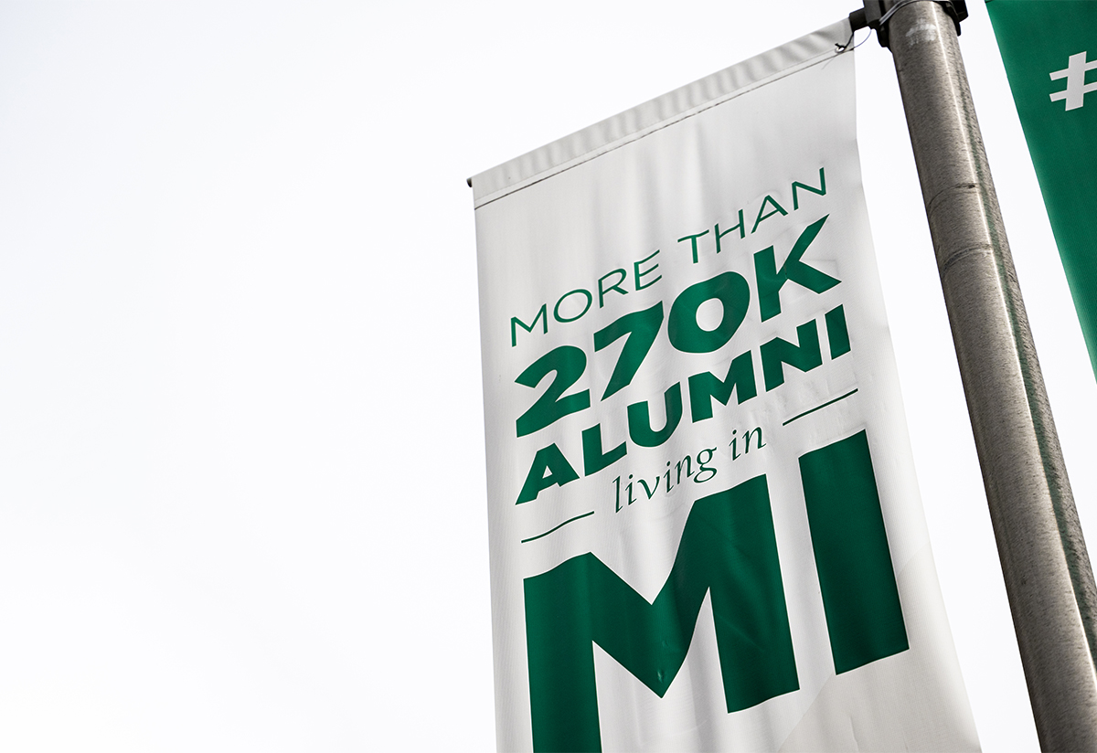  banner advertising more than 270,000 honorary college alumni living in Michigan