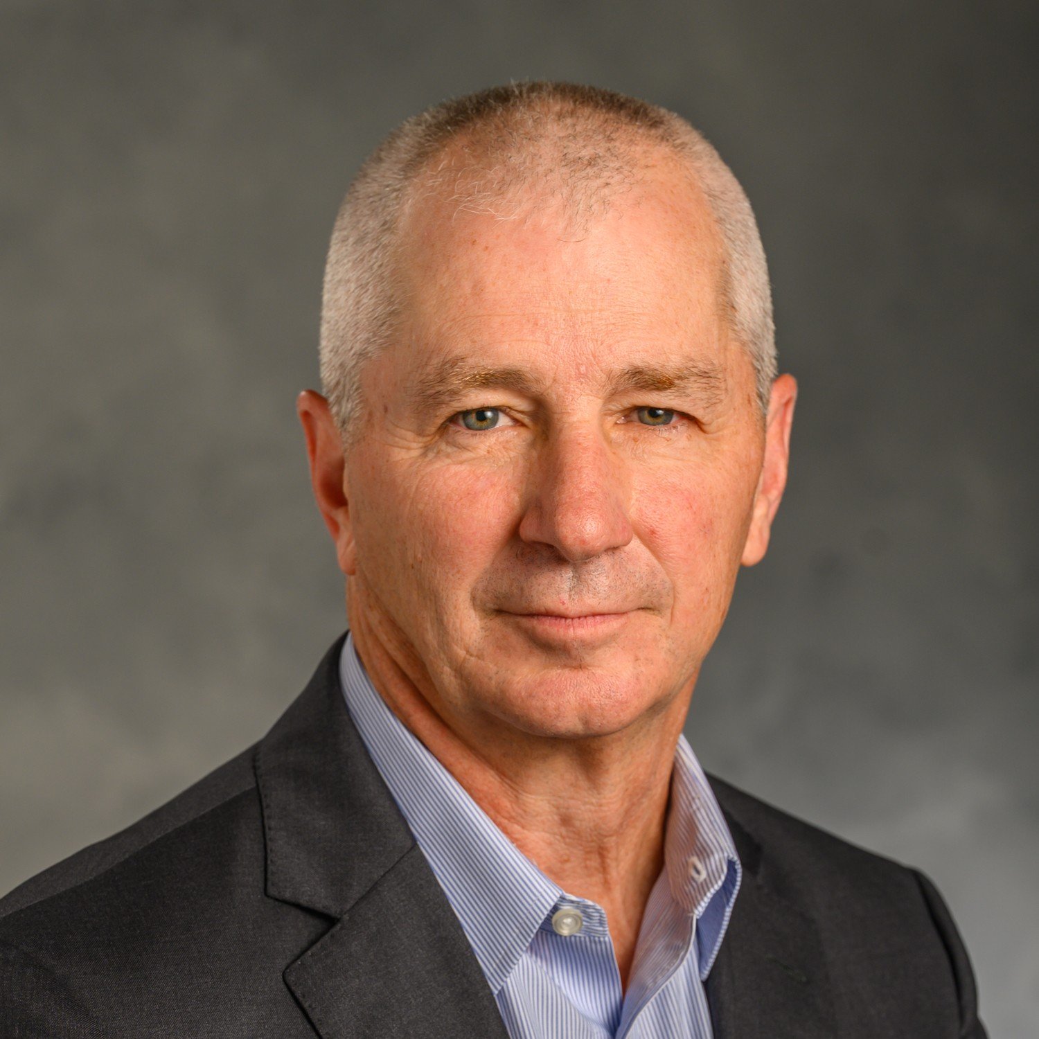 Headshot of Dr. Steve Chermak in front of a professional background.