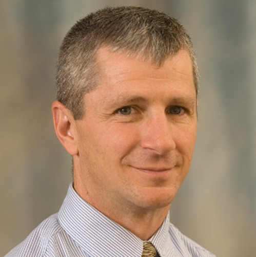 Headshot of Steve Chermak in front of a professional background