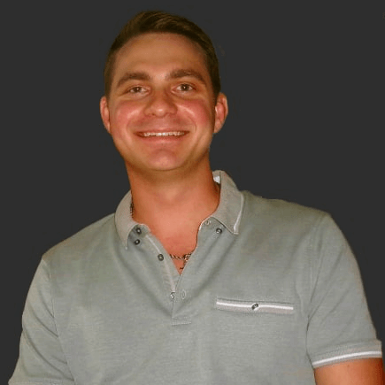 Headshot of Chase Flowers in front of a professional background/