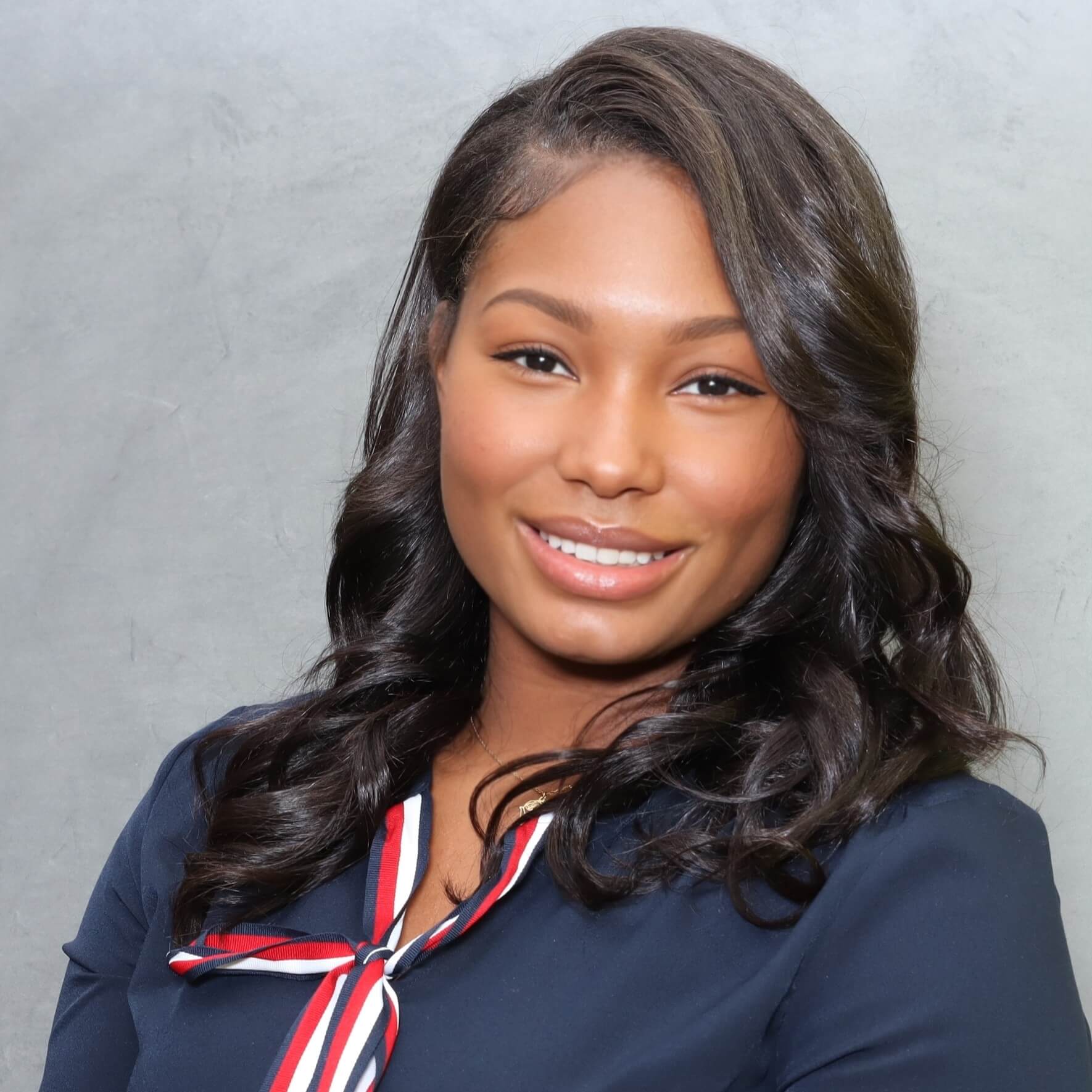 Headshot of Antonia Gordon in front of a professional background