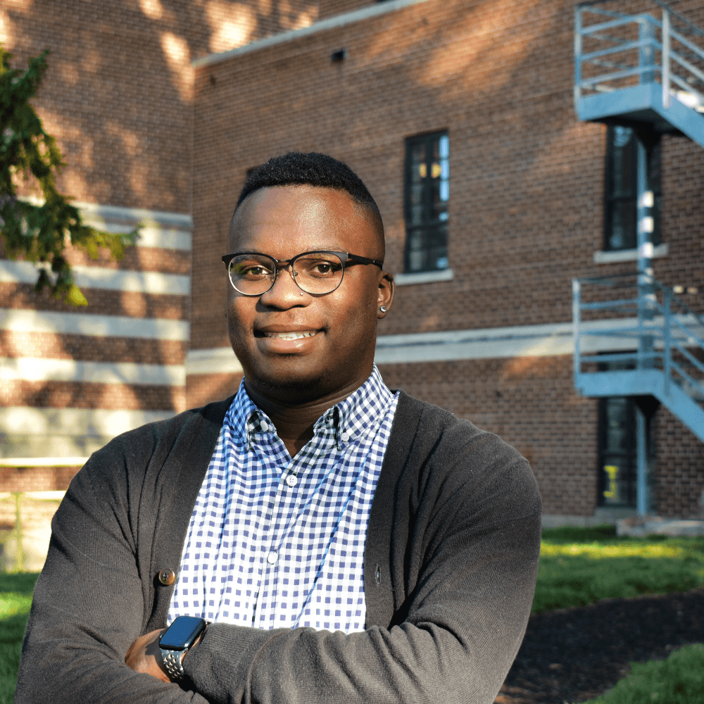 Headshot of Jordan Parker standing in front of a brick building on MSU's campus.