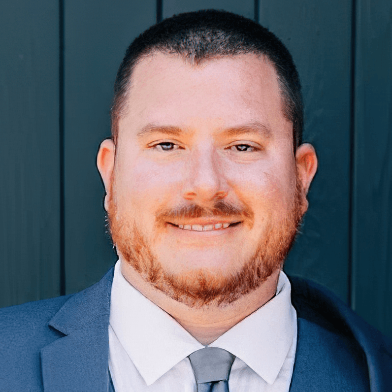 Headshot of Dr. Brandon Turchan in front of a professional background.