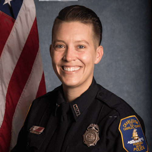 Headshot of Terry Cherry in front of a professional background and an American Flag