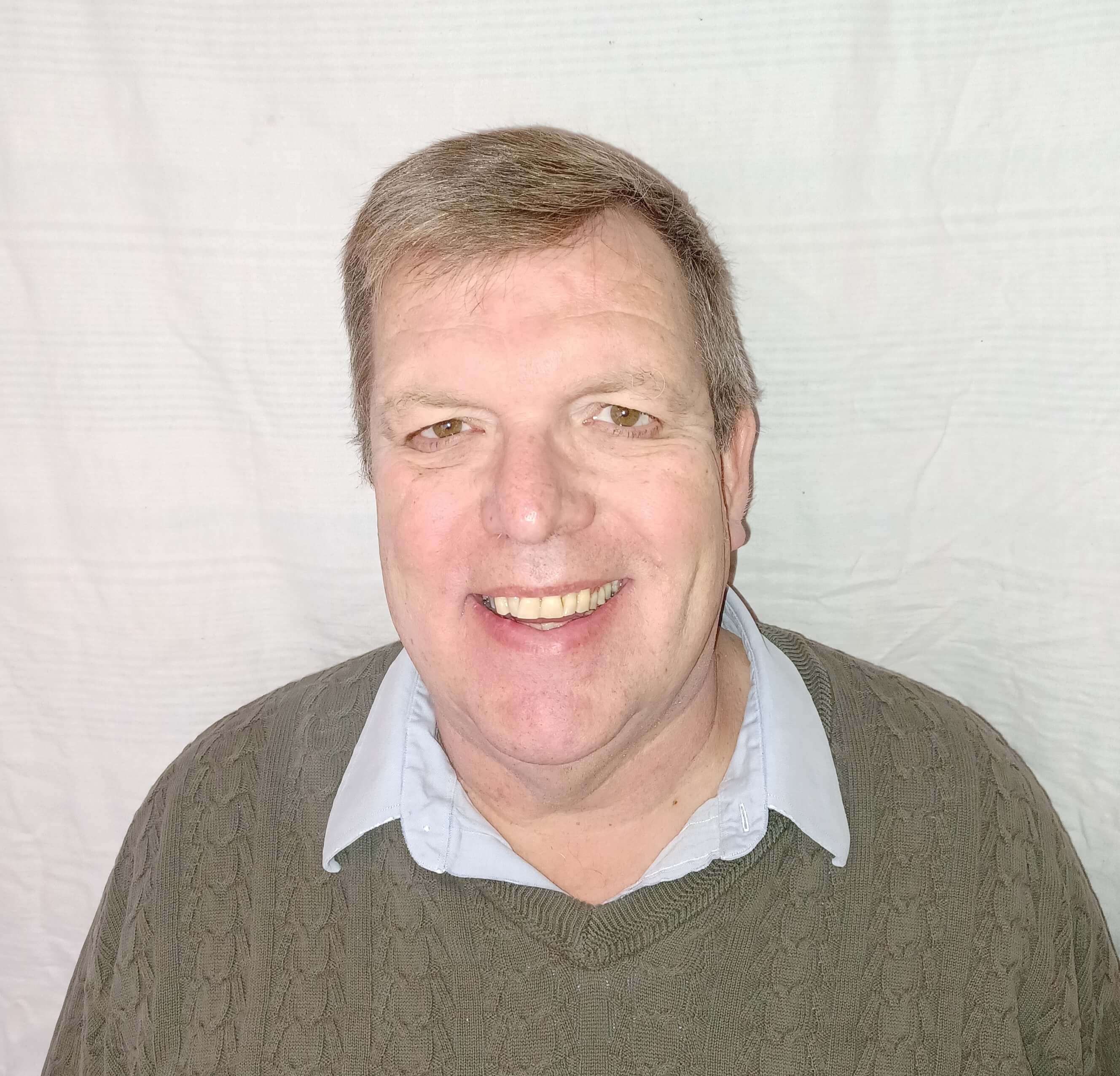 Headshot of Clifford Grammich in front of an empty background.