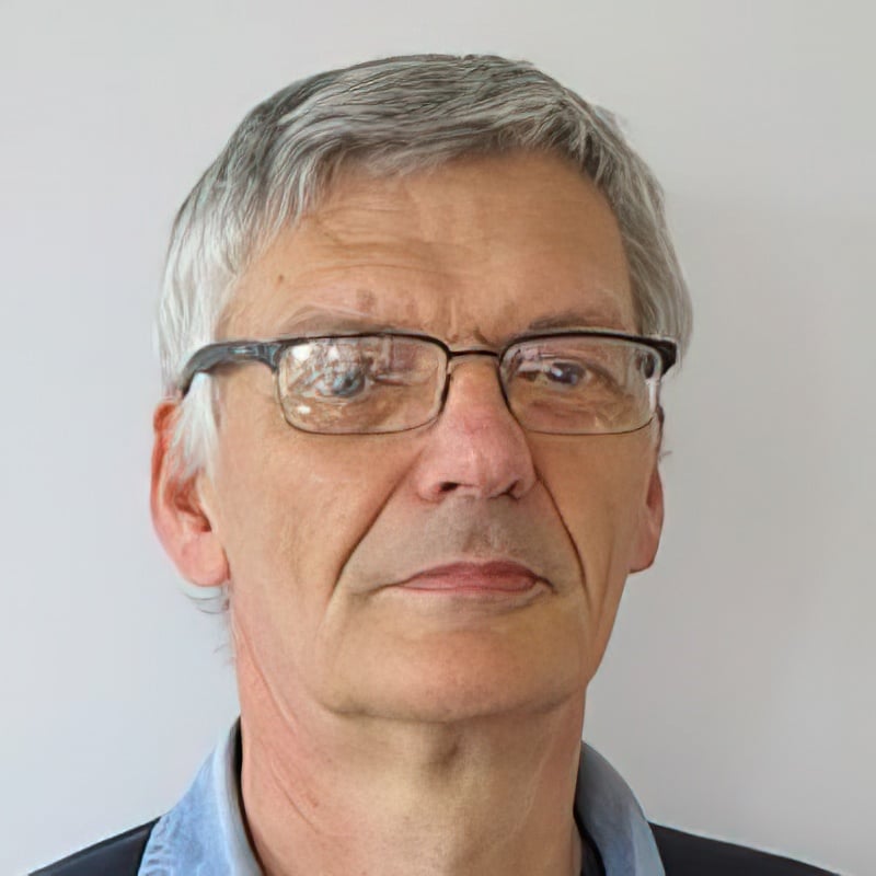 Headshot of David Shepherd in front of a blank background.