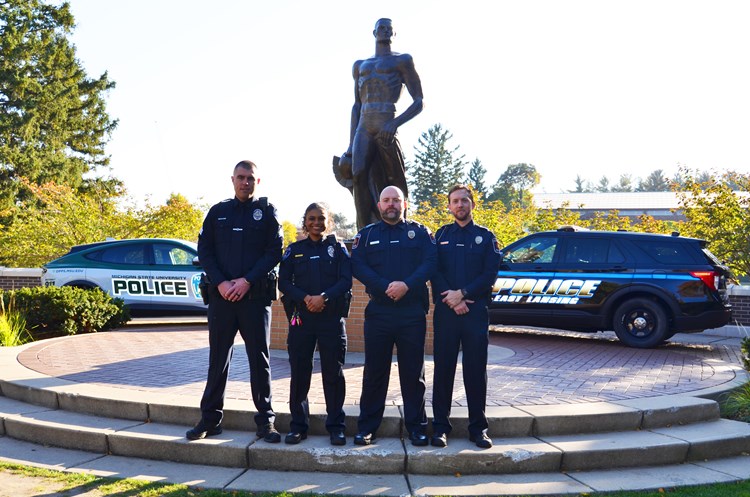 PEACE Team posing in front of Sparty Statue