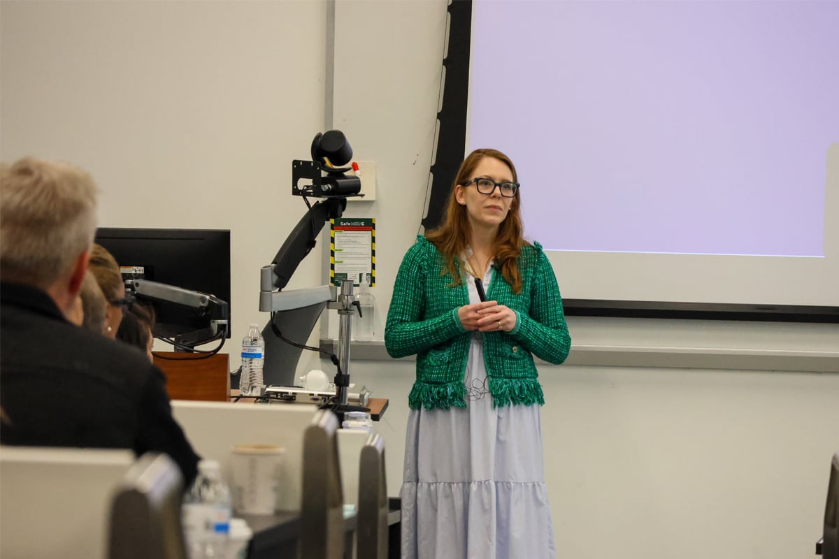 AI Summit keynote speaker Madelyn speaking at the front of the room.