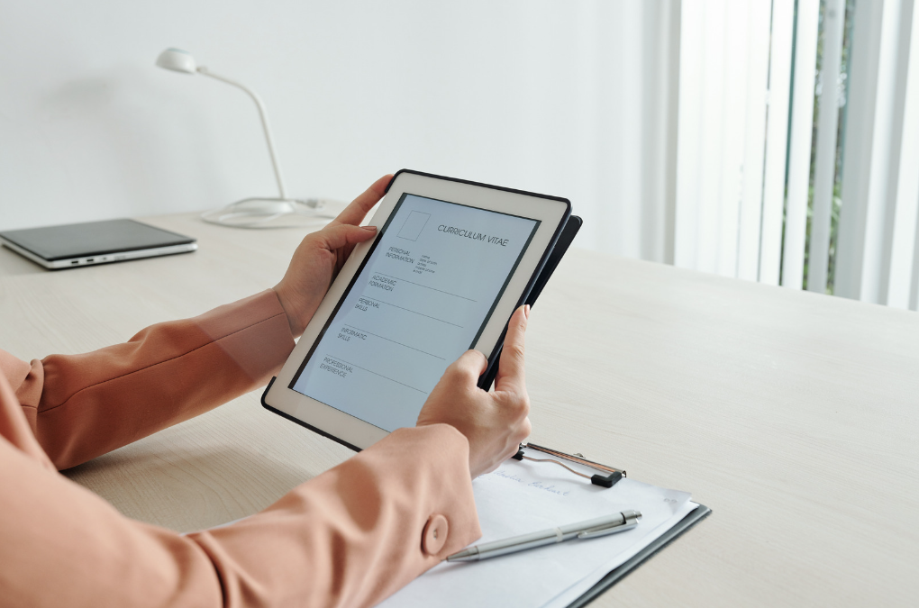 Woman using a tablet to pick classes