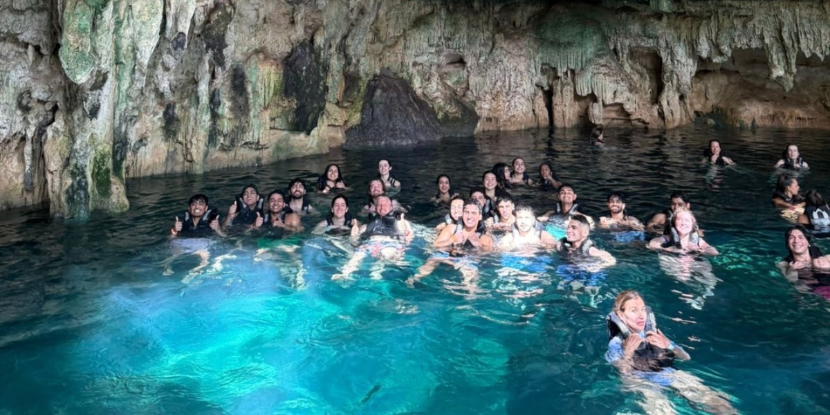 MSU students swimming in a Cenote pool during a pre-clinical observation program in the Yucatán Peninsula. 