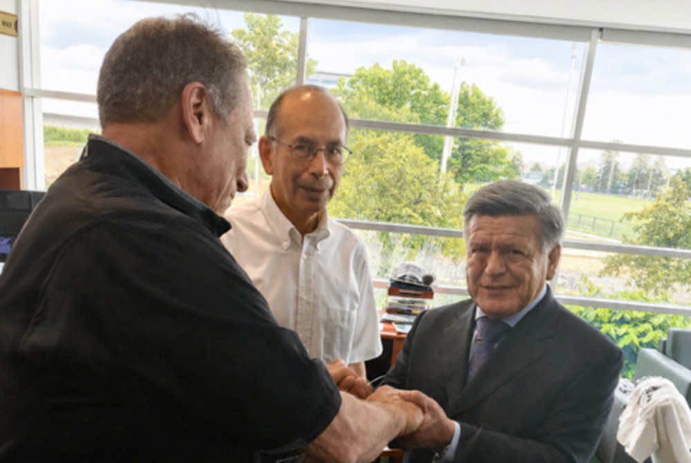 Universidad César Vallejo owner and founder Cesar Acuña Peralta meeting with MSU men’s basketball head coach Tom Izzo during his inaugural visit to MSU.