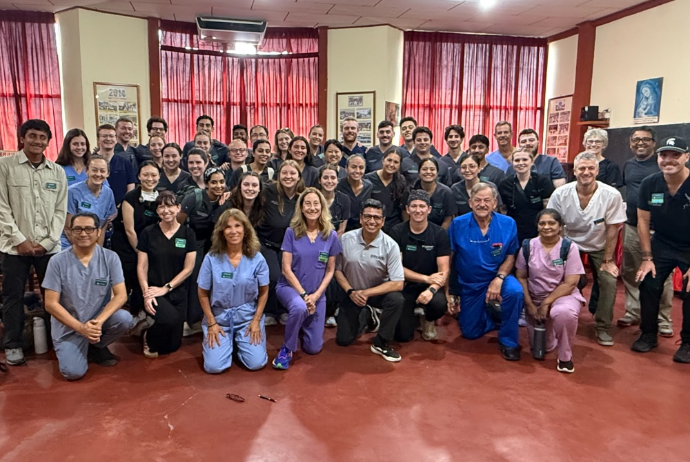 MSU physicians, local physicians and medical students taking a group picture at a medical clinic in Iquitos, Peru.