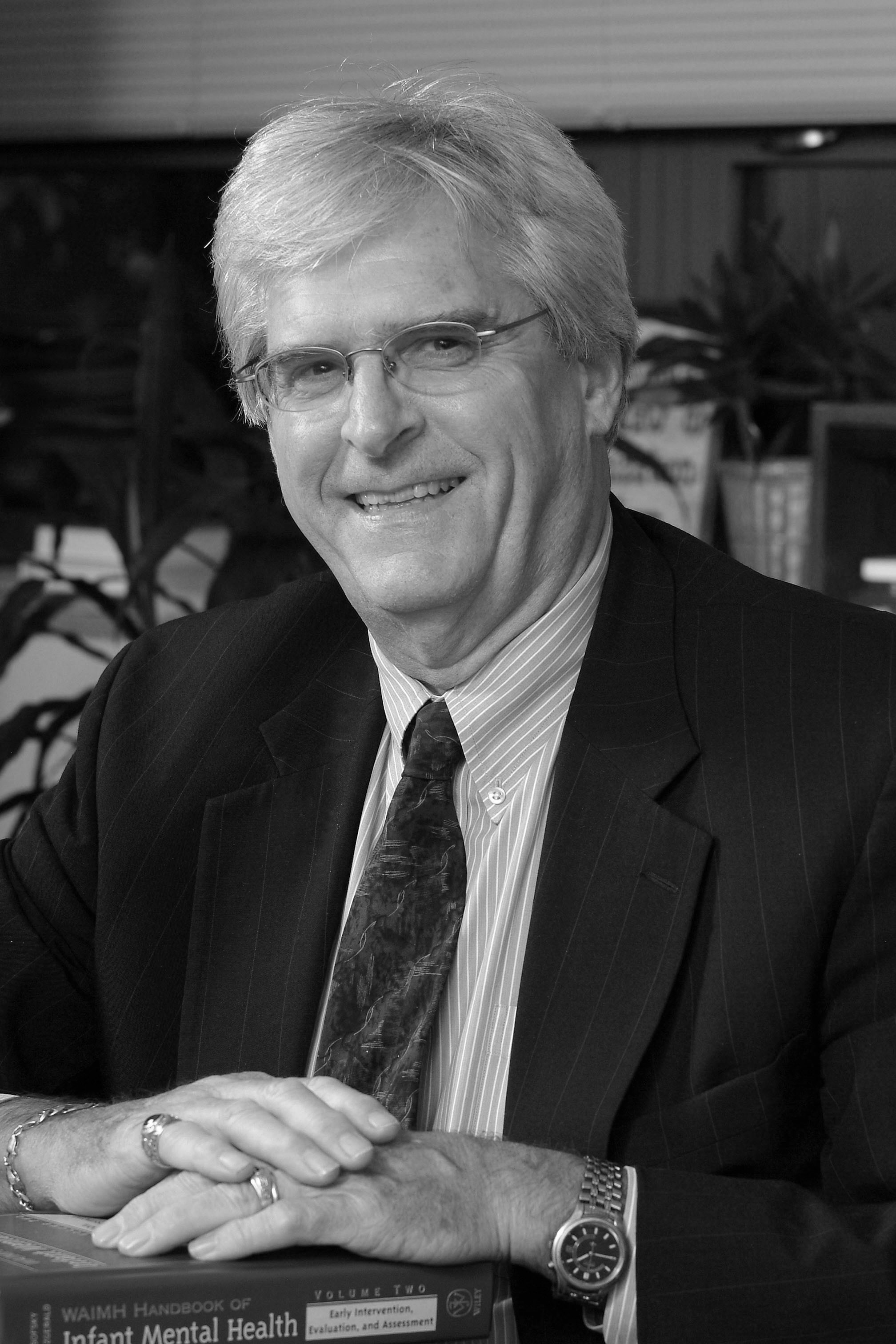A black and white photo of Hiram Fitzgerald in a suit and tie.