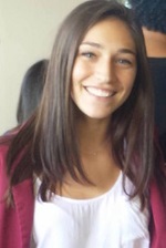 Alyssa Lopez in a white shirt and pink jacket.