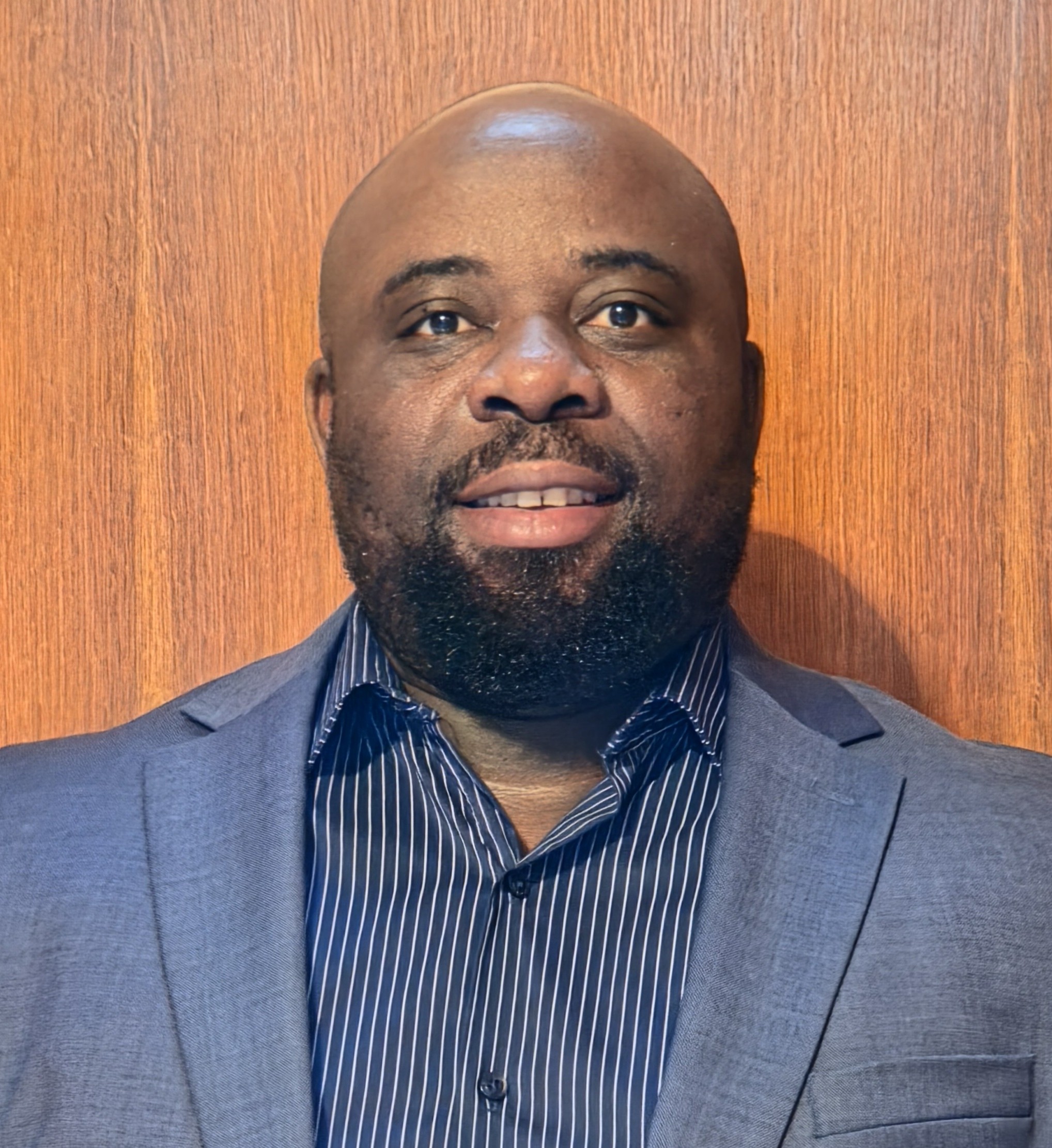 Headshot portrait of Nicholas Nyachega.