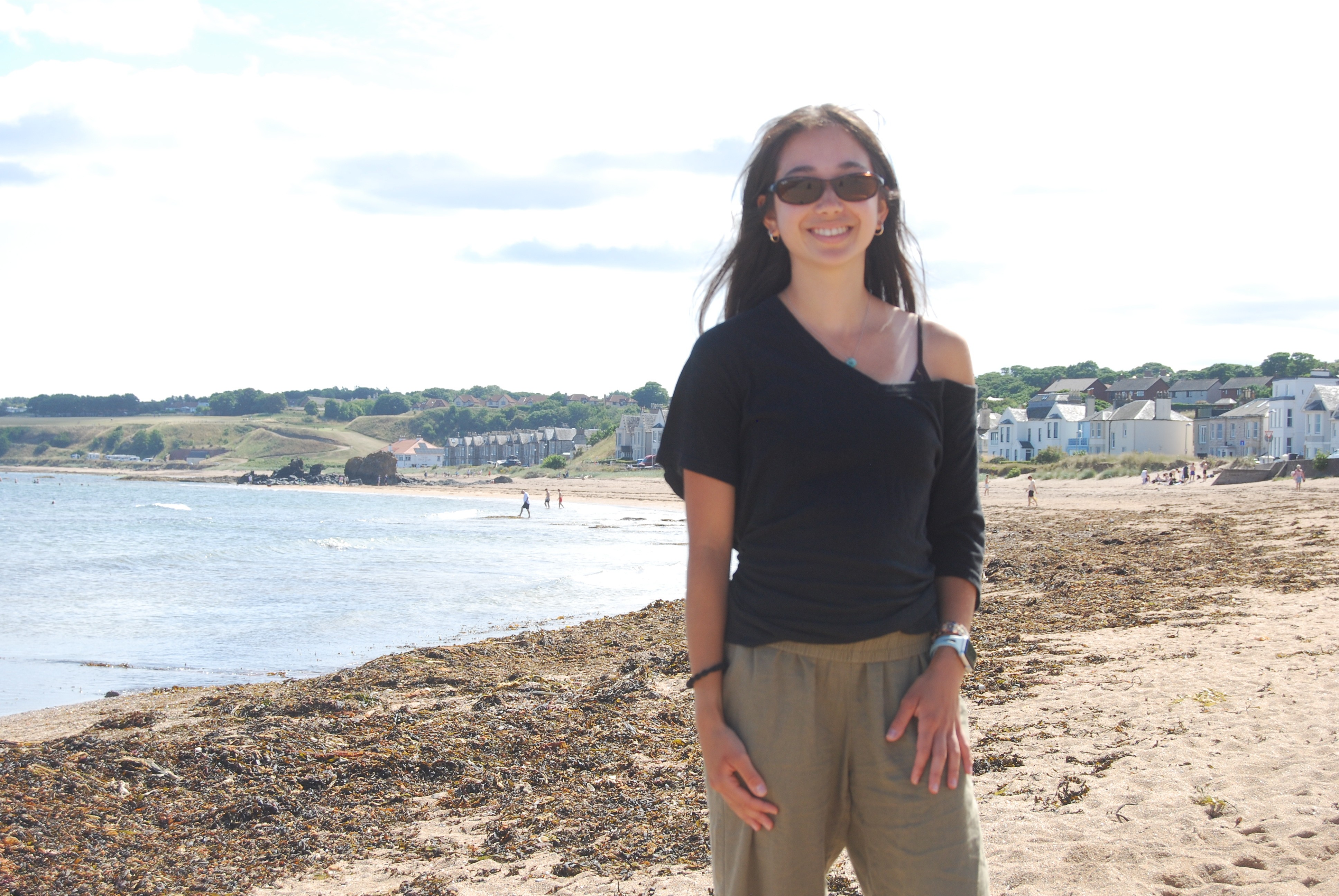 Haley Kurak standing on a beach.