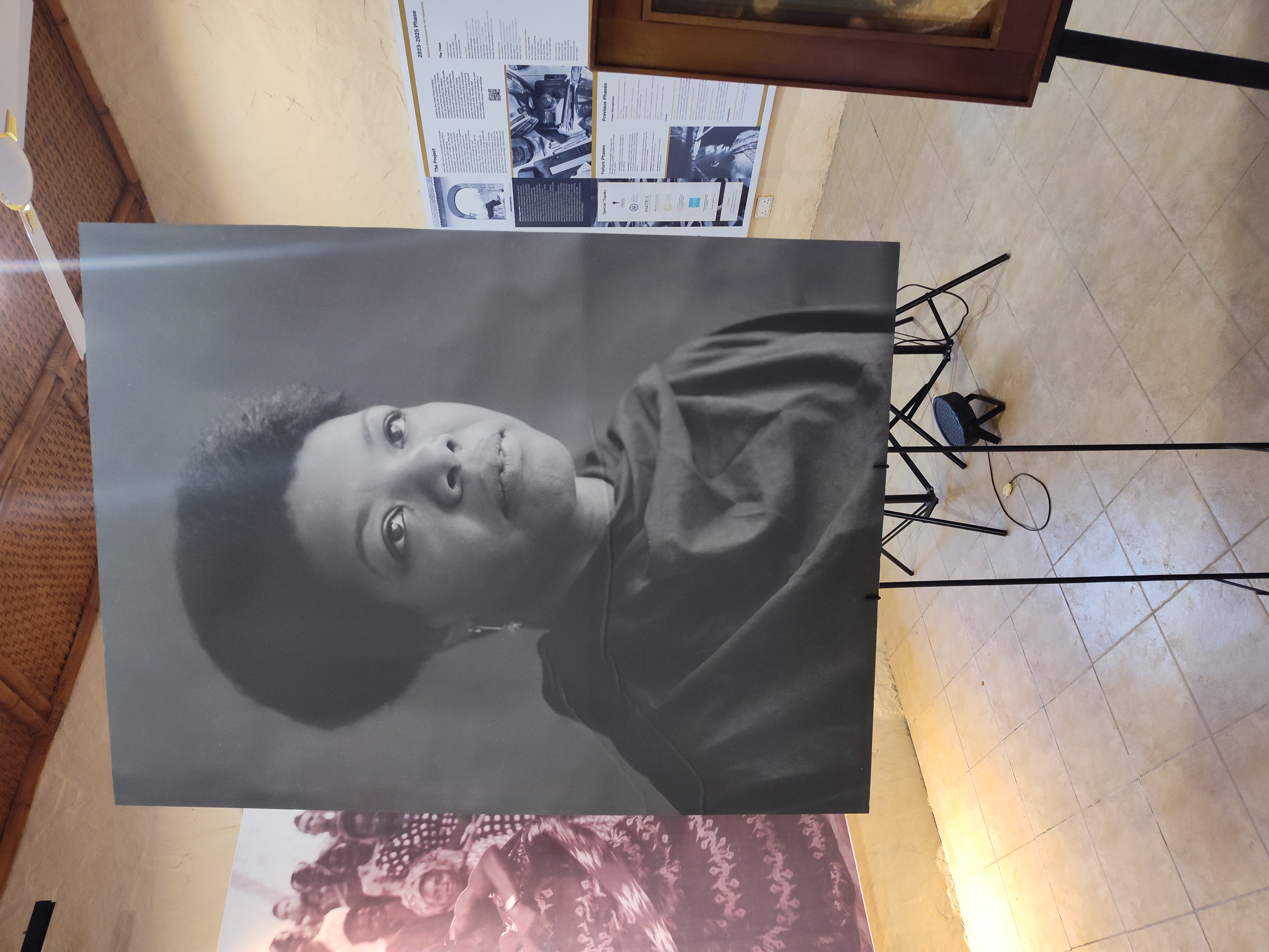 Easel portrait of Maya Angelou on a stand.