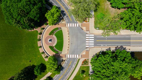 An aerial drone photo of the intersection of Red Cedar Road and Kalamazoo Street, in front of the Spartan Statue.