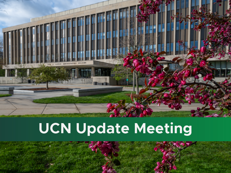 A photo of the Administration Building surrounded by flowering trees, with a green stripe along the bottom and white text reading "UCN Update Meeting"