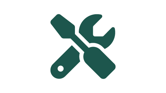 A dark green icon illustration of a screwdriver and wrench crossed in an X shape.