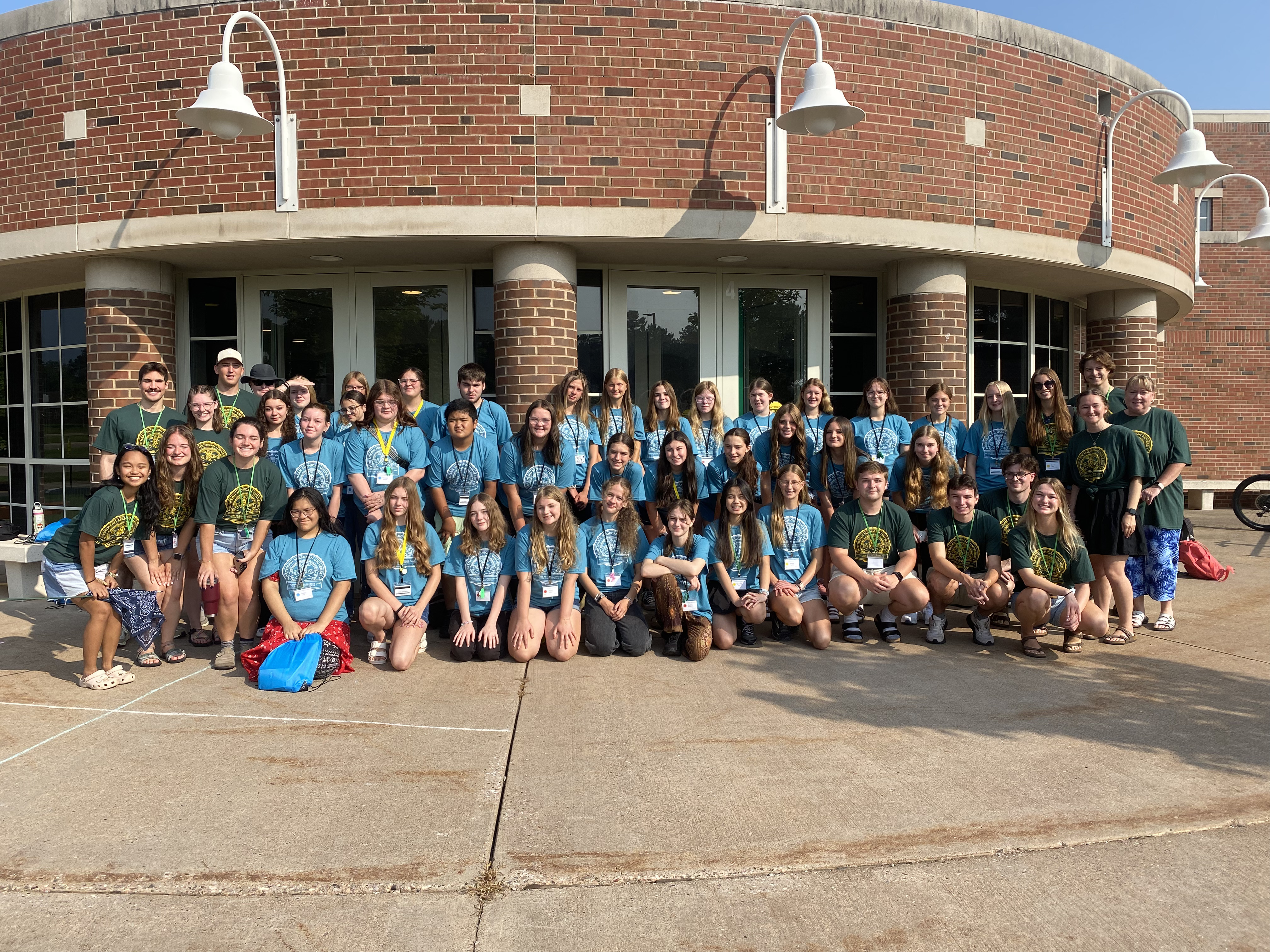 NMU Center for Rural Health U.P. Future Health Leaders Camp 2025 Group photo of 30 plus high school students. Most are wearing a light blue t-shirts. 