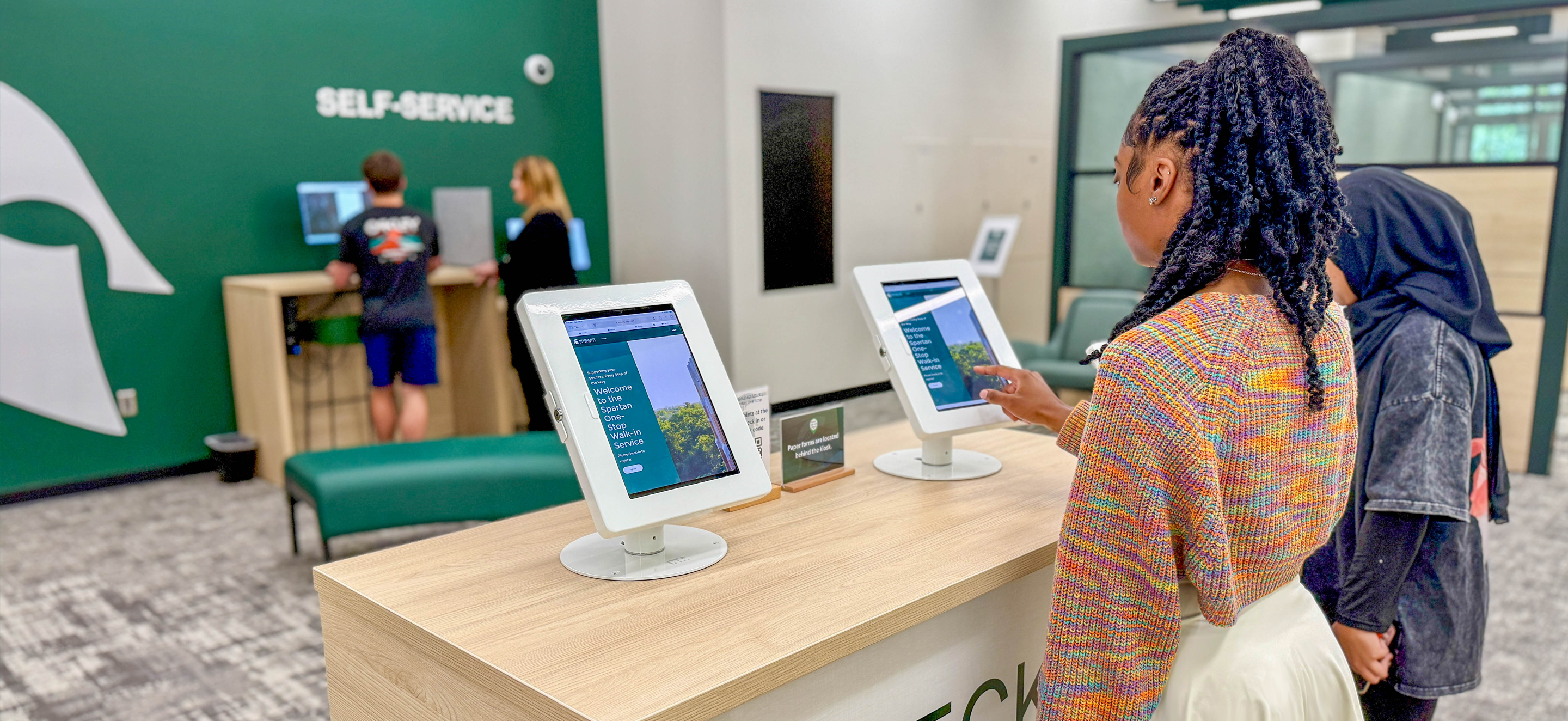 Students checking in at the One-Stop space in the Administration Building.