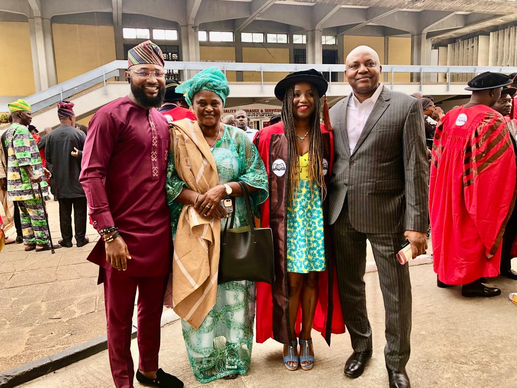 Four people posing for a photo, one of them Dr. Nwando Achebe
