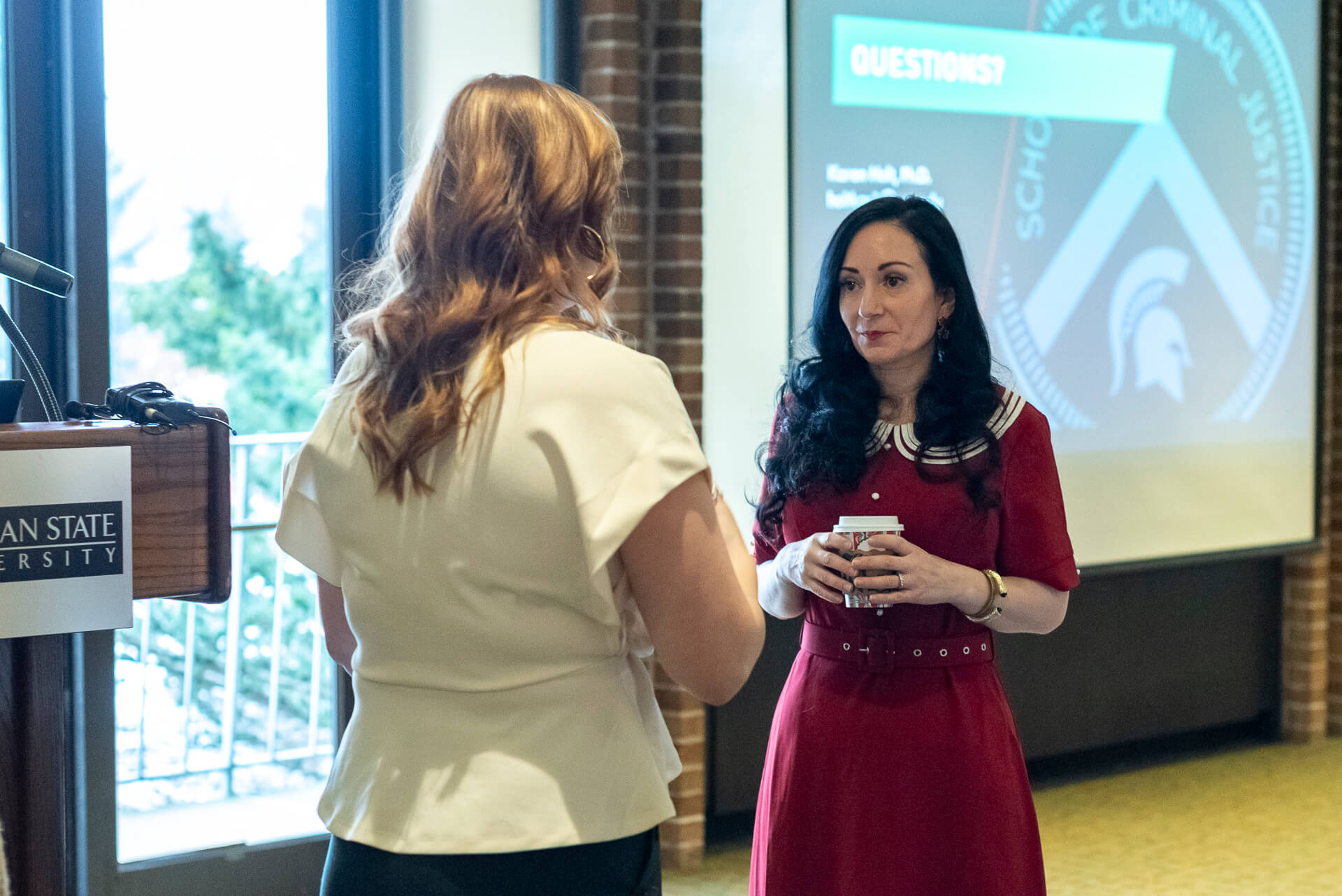 Dr Karen holt talks with a training participant