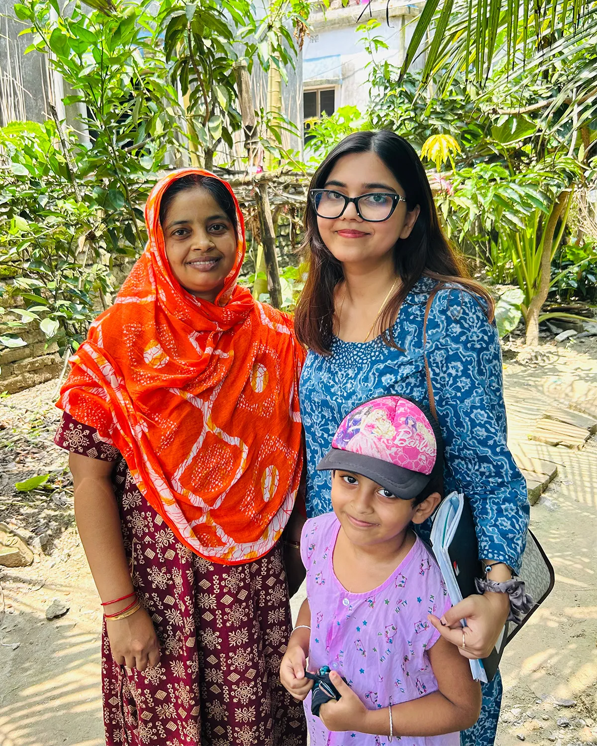 Gungun Islam poses with another woman and a child