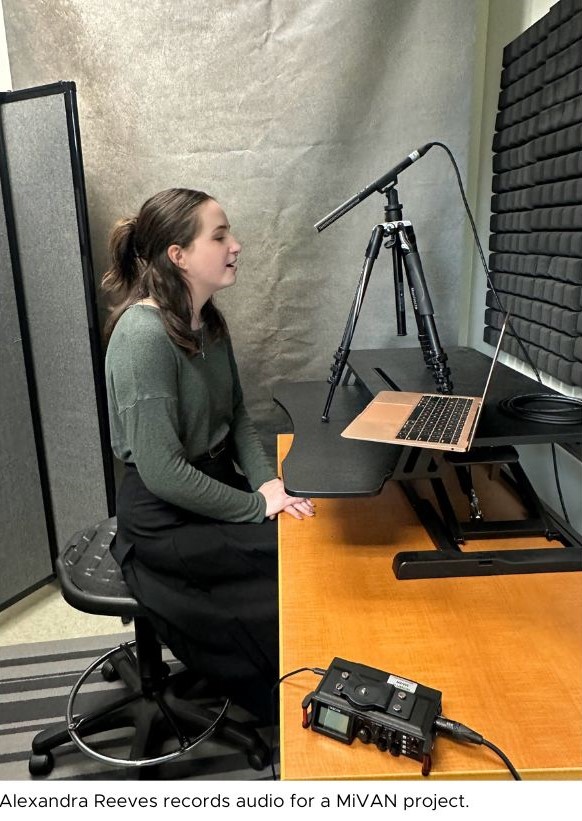 A woman records audio for a MiVan project as she speaks into a microphone in a studio