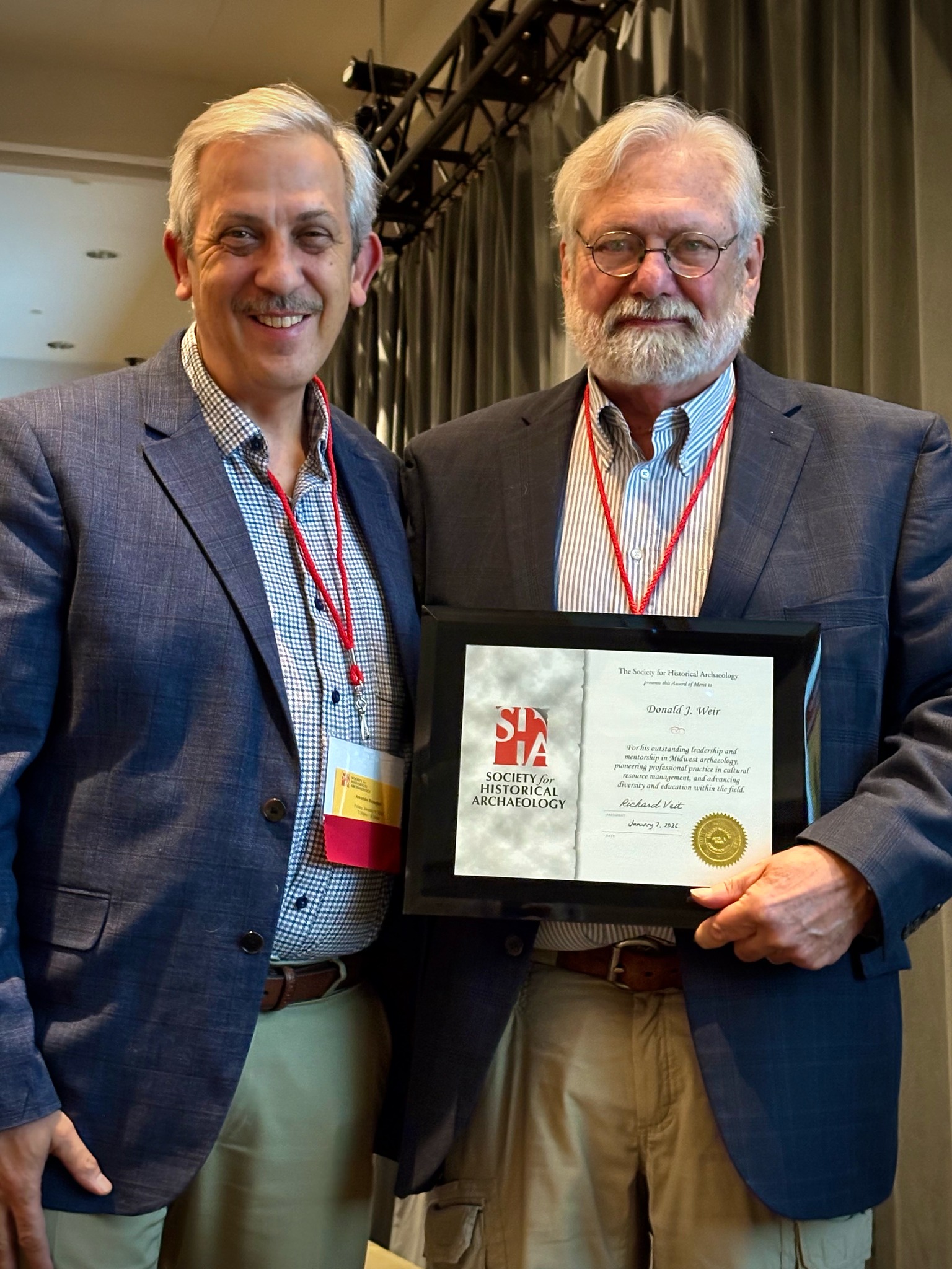 Don Weir holds his award.