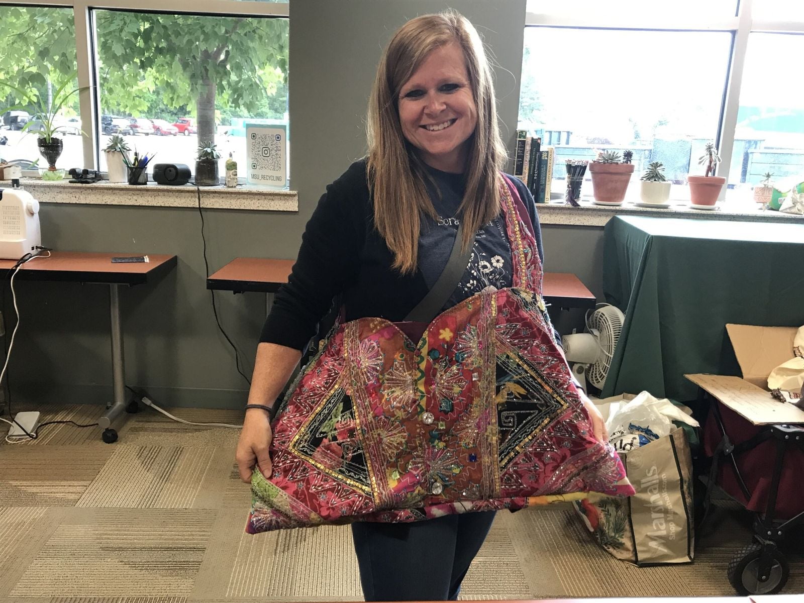 Community member with a refashioned purse.