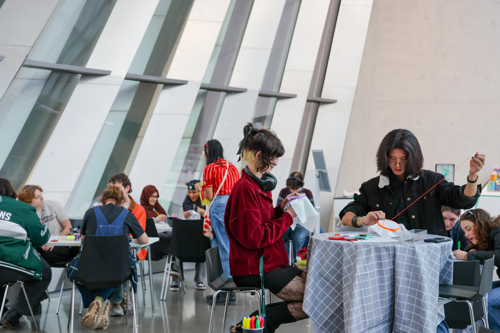 People sewing at tables