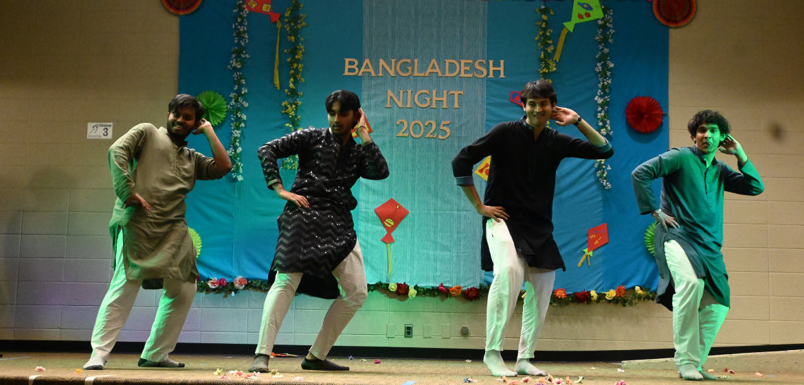 Four college students perform a dance at a Bangladesh Night event.