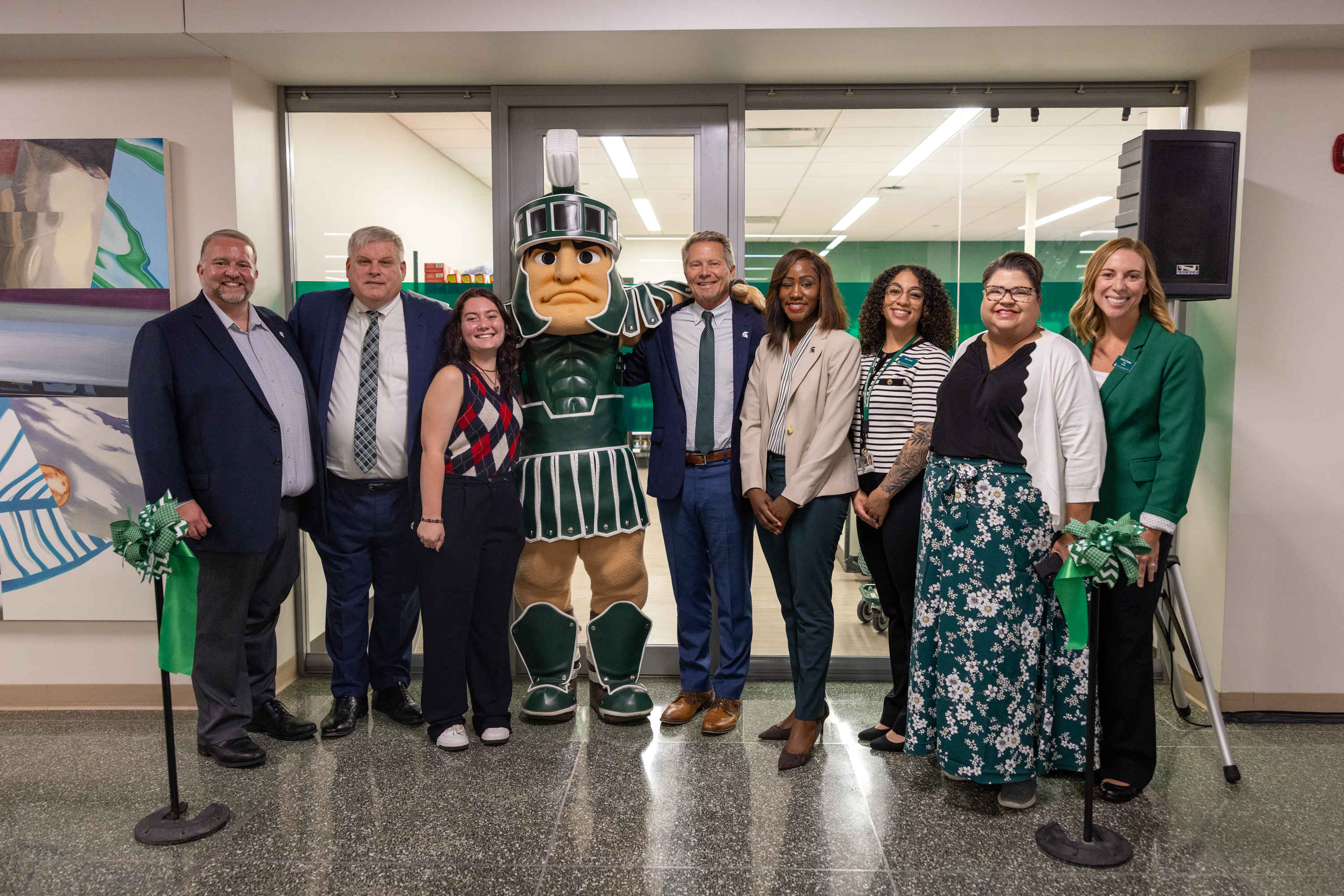 Group photo with Sparty after the ribbon cutting for the Spartan Shelf Union location