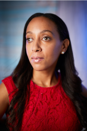 Photo portrait of Haben Girma, a Black woman in her mid 30's with medium length black hair and brown eyes