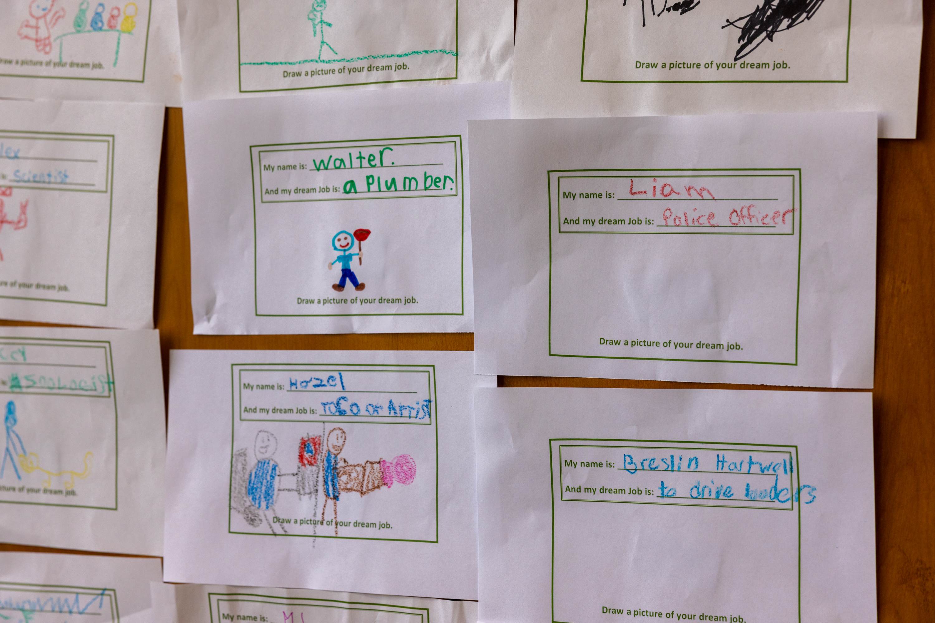 children's drawings that show names and dream jobs