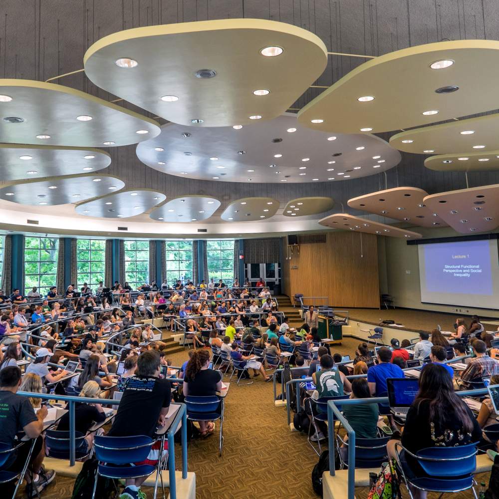MSU students gathered in the circular Kiva lecture hall lined with windows