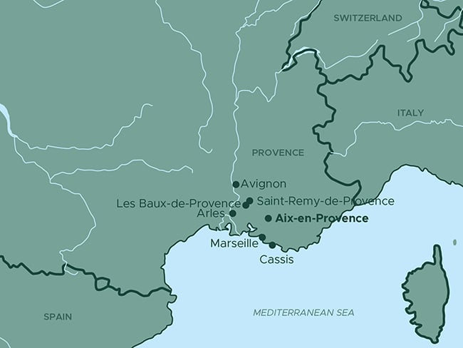 A map of southern France highlighting key locations in Provence, including Avignon, Aix-en-Provence, Marseille, Cassis, Les Baux-de-Provence, Saint-Remy-de-Provence, and Arles. The map also shows nearby countries, such as Switzerland and Italy, as well as the Mediterranean Sea to the south. The geographic context emphasizes the region's proximity to the coastline and neighboring regions.