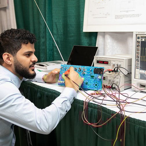 MSU Engineering student showing off their project during the 2019 Design Day