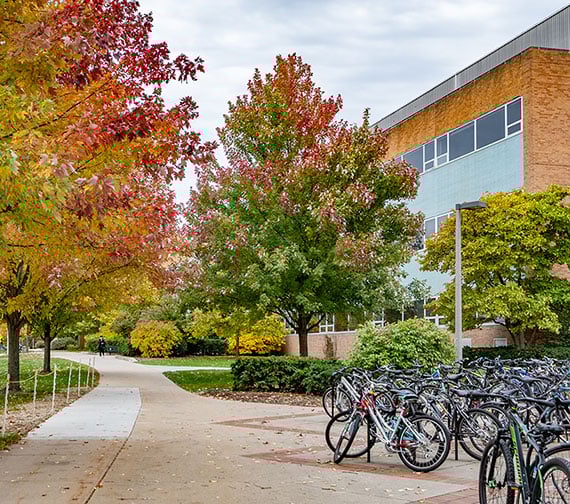 Engineering building in front of Shaw lane road, there are bikes parked in front of the building