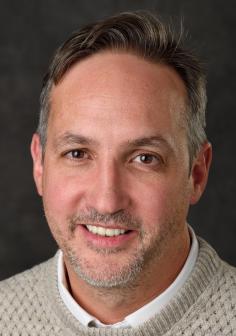 Professional headshot of Andre Benard