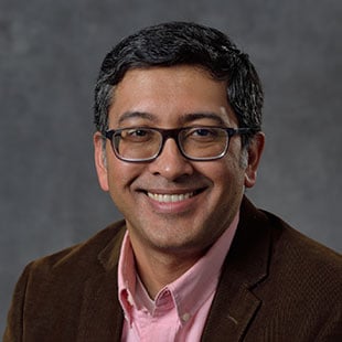 Professional headshot of Sudin Bhattacharya