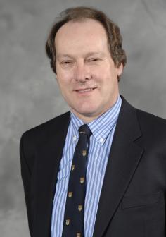 Professional headshot of Giles Brereton